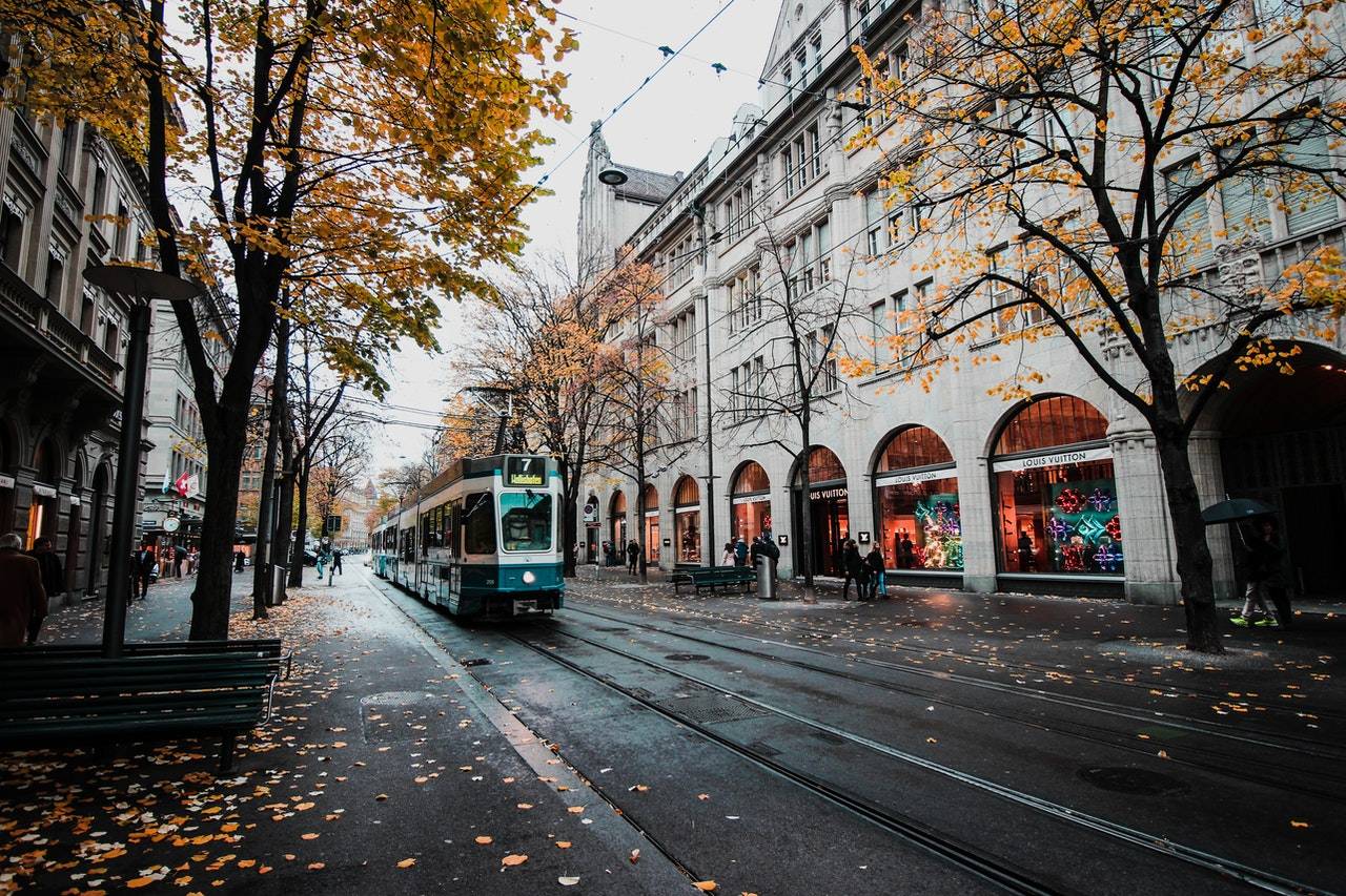 train passing on street - All About Europe by Darren Yaw Released